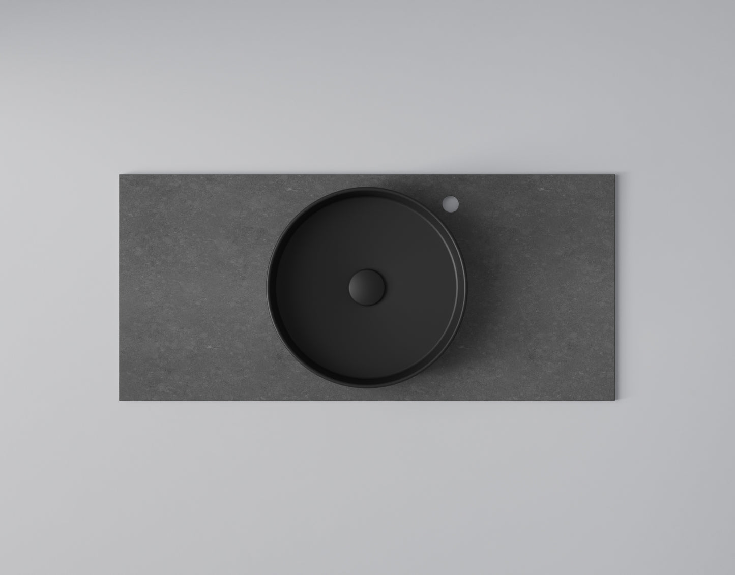 INR Tvättställ Soak i Matte Black på bänkskiva Flow Raven (bänkskiva säljs separat). Bild: INR